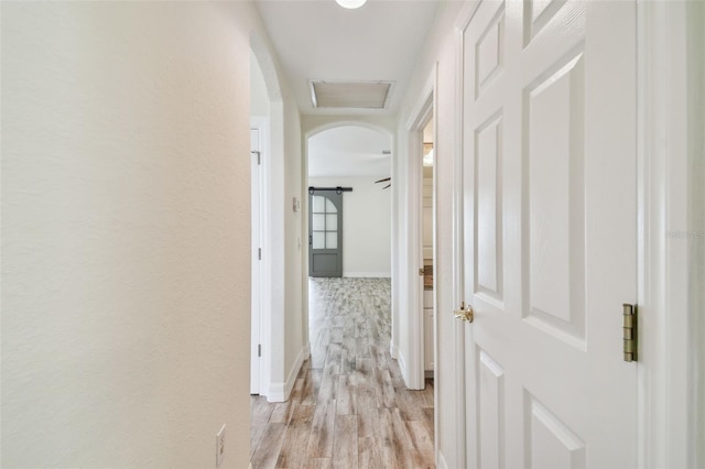 hall with light hardwood / wood-style flooring