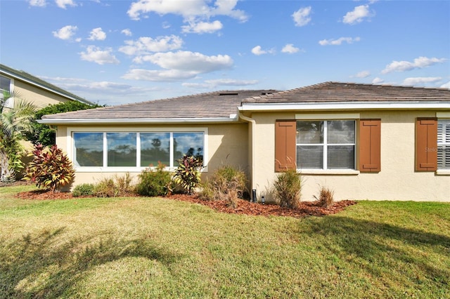 view of property exterior featuring a yard