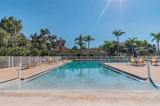 view of swimming pool with a patio