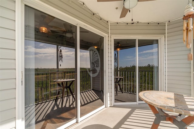 exterior space featuring ceiling fan