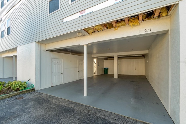 garage featuring a carport