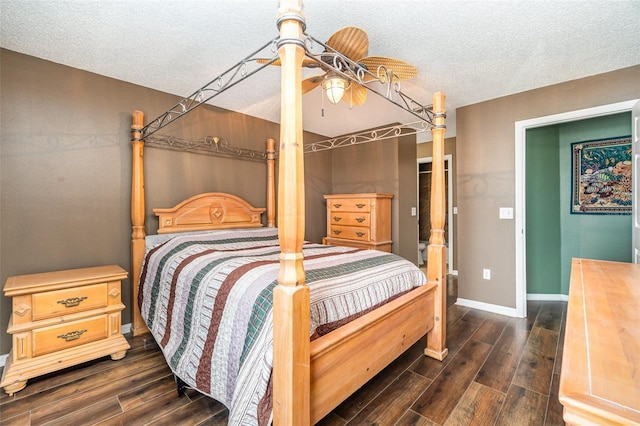 bedroom featuring ceiling fan and a textured ceiling