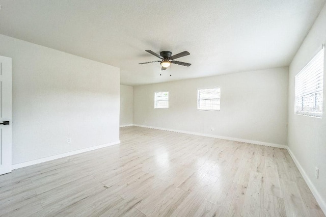 unfurnished room with ceiling fan and light hardwood / wood-style floors