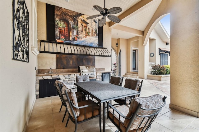 view of patio / terrace featuring an outdoor kitchen, area for grilling, outdoor dining space, a sink, and ceiling fan