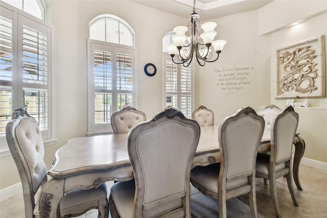 tiled dining space with a wealth of natural light and a chandelier