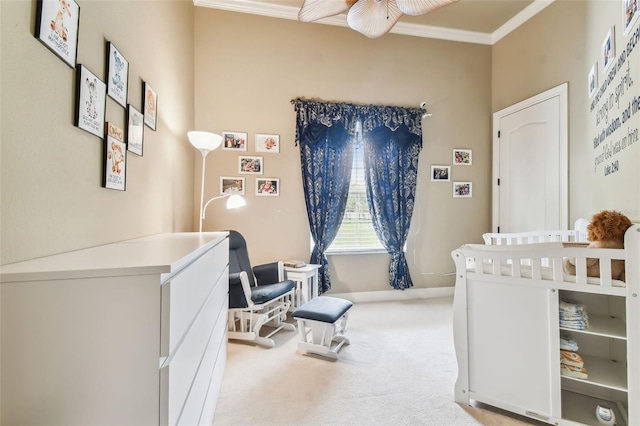 carpeted bedroom with ornamental molding and a nursery area