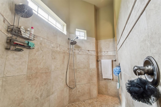 bathroom featuring a tile shower