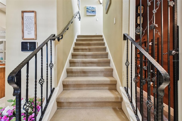 stairs featuring baseboards