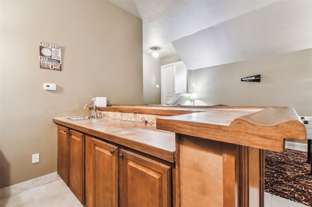 interior space featuring a sink and tile patterned floors