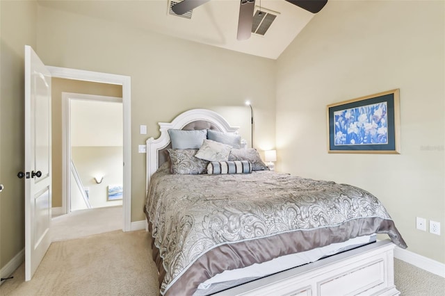 bedroom featuring light colored carpet, vaulted ceiling, visible vents, and baseboards