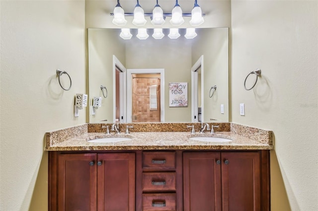 bathroom featuring double vanity and a sink