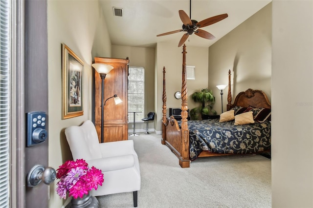 bedroom with carpet floors, visible vents, and baseboards