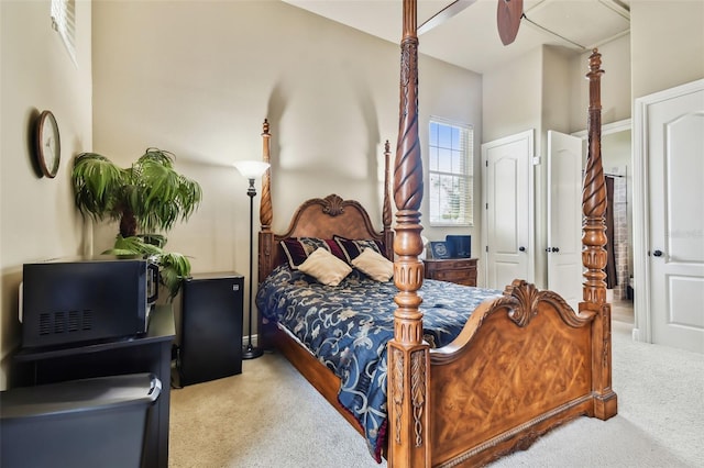 carpeted bedroom featuring ceiling fan