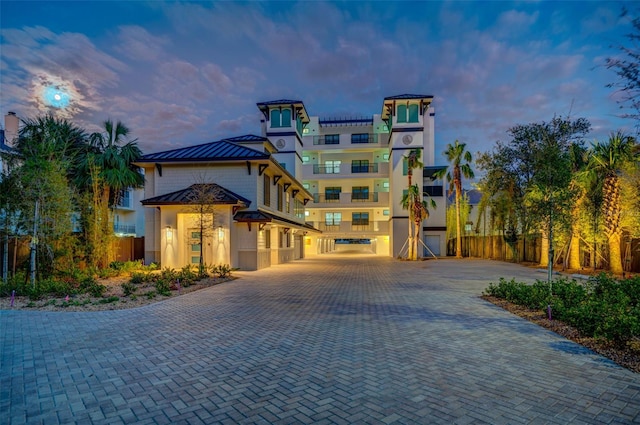 outdoor building at dusk with a garage