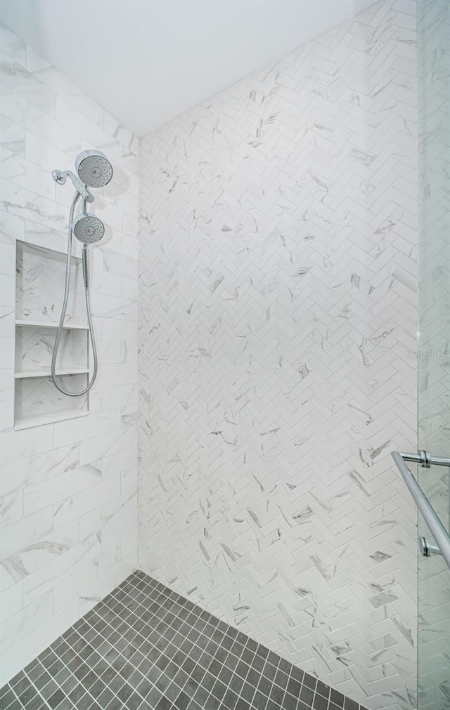 bathroom with tiled shower