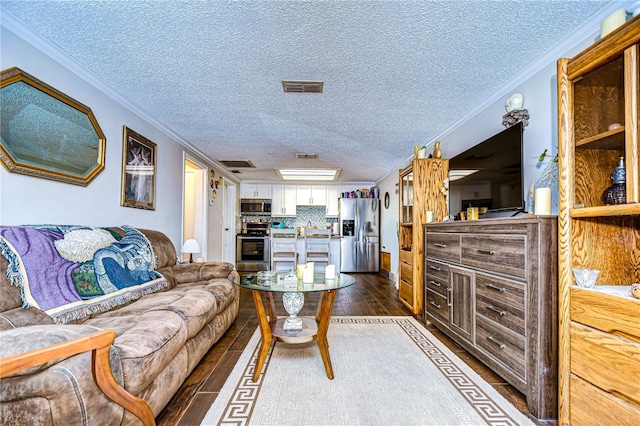 living room featuring crown molding, dark hardwood / wood-style flooring, a textured ceiling, and sink