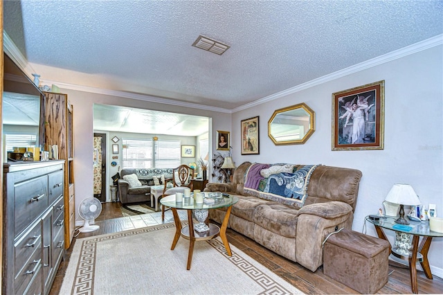 living room with dark hardwood / wood-style floors, ornamental molding, and a textured ceiling