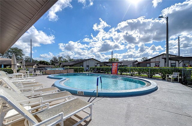 view of swimming pool with a patio area