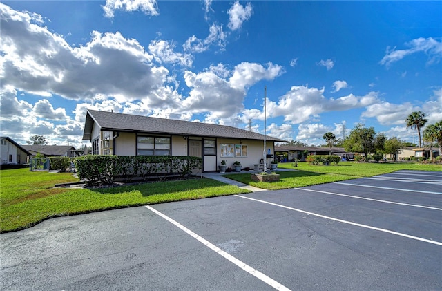 view of car parking featuring a yard