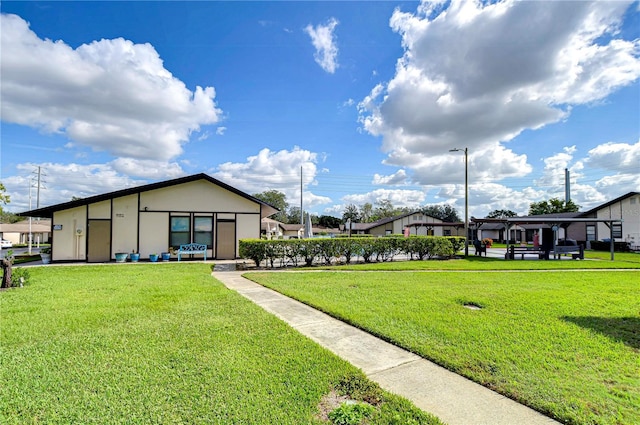 view of community featuring a lawn