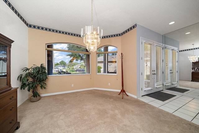 interior space featuring a textured ceiling, light carpet, and an inviting chandelier