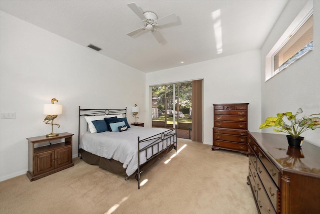 carpeted bedroom featuring ceiling fan and access to outside