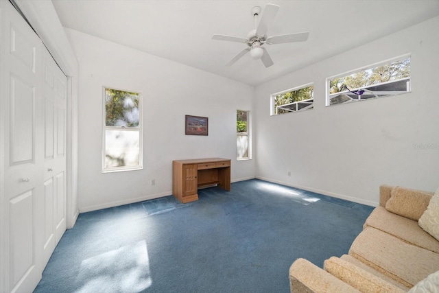 interior space with ceiling fan and carpet