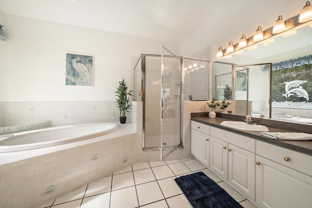 bathroom featuring tile patterned floors, vanity, and independent shower and bath