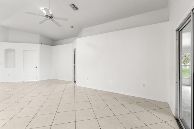 tiled spare room featuring ceiling fan and vaulted ceiling