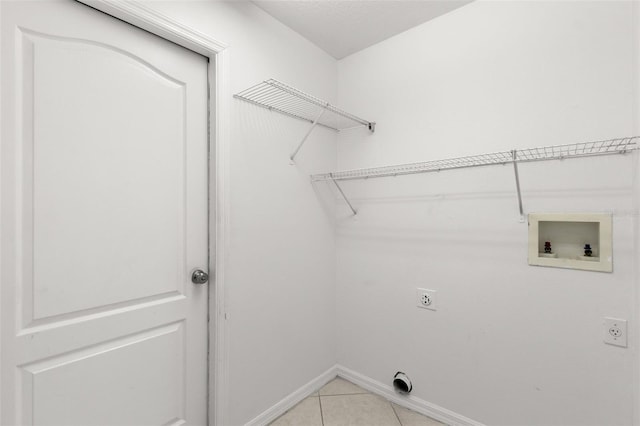 laundry room featuring hookup for an electric dryer, washer hookup, and light tile patterned floors