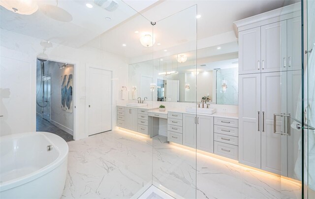 bathroom featuring separate shower and tub and vanity