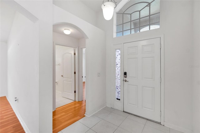 foyer entrance with light hardwood / wood-style floors