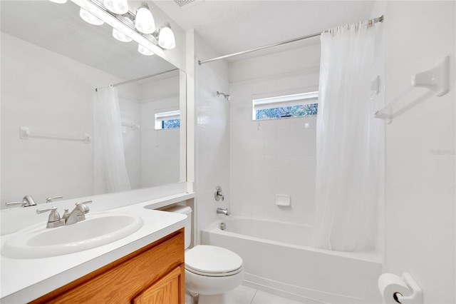 full bathroom with tile patterned flooring, vanity, shower / tub combo, and toilet