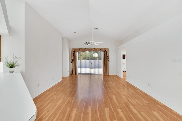 unfurnished living room with light wood-type flooring, vaulted ceiling, and ceiling fan