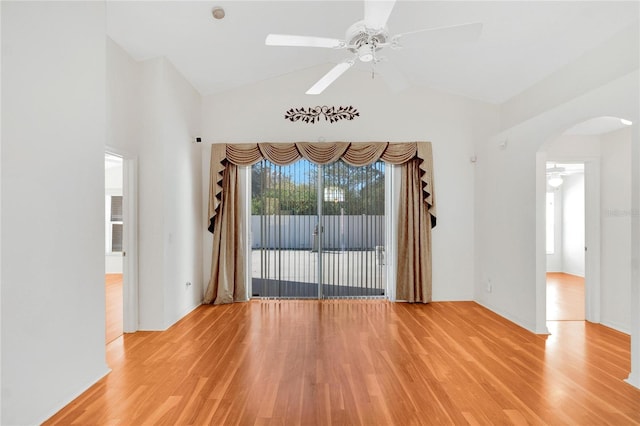 unfurnished room featuring ceiling fan, hardwood / wood-style floors, and vaulted ceiling