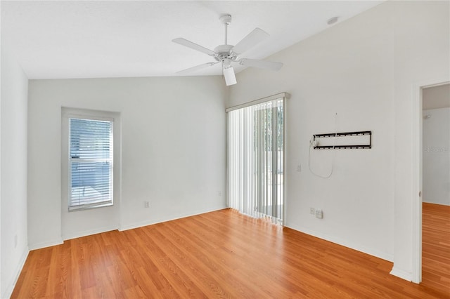 spare room featuring light hardwood / wood-style flooring, ceiling fan, and lofted ceiling