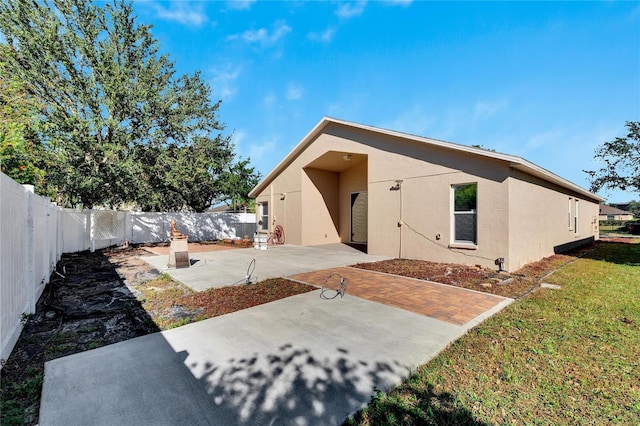 rear view of house featuring a patio area