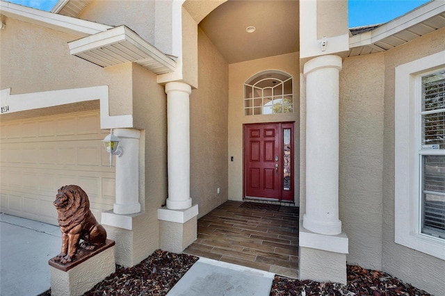 view of exterior entry featuring a garage