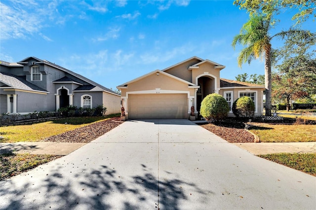 view of front of home featuring a garage and a front yard