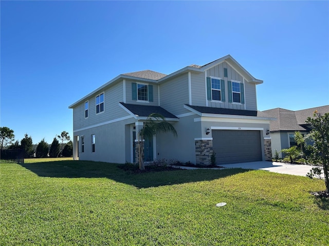 view of front facade featuring a front lawn and a garage