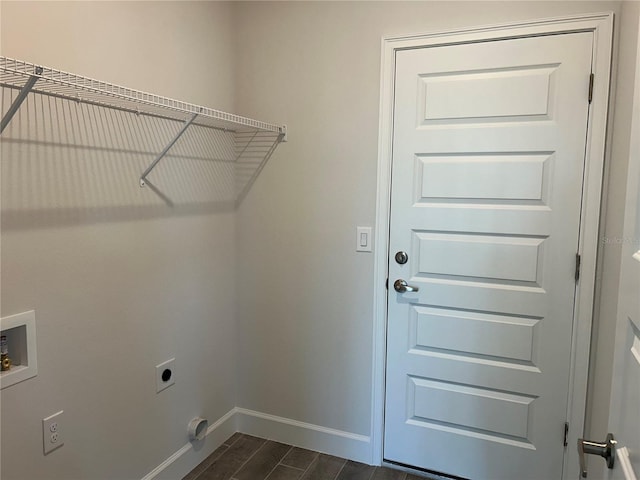 laundry room with electric dryer hookup, dark hardwood / wood-style flooring, and washer hookup