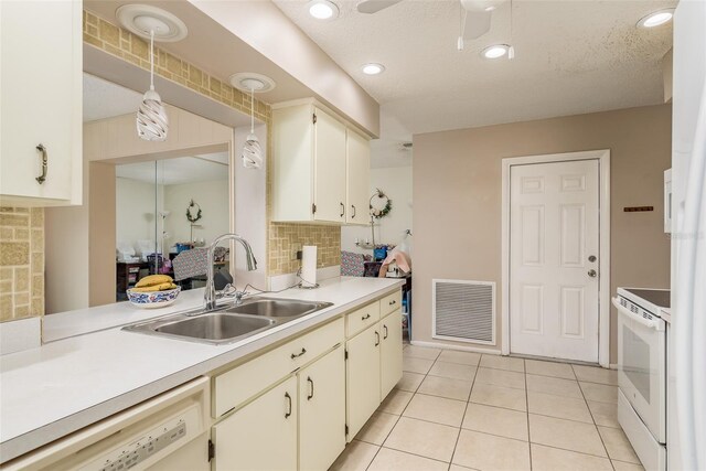 kitchen with white appliances, sink, decorative backsplash, decorative light fixtures, and light tile patterned flooring