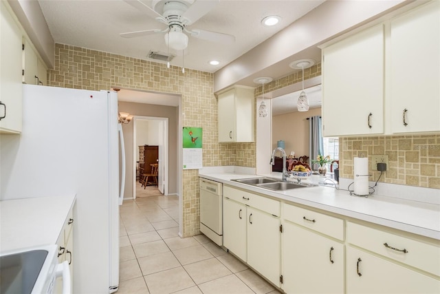 kitchen with ceiling fan, sink, tasteful backsplash, white appliances, and light tile patterned floors