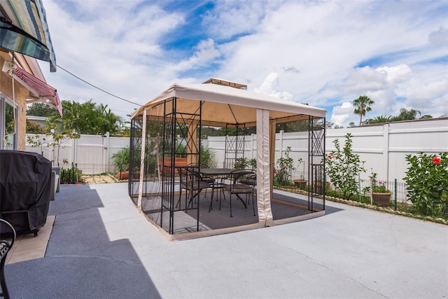 view of patio / terrace with a gazebo and grilling area