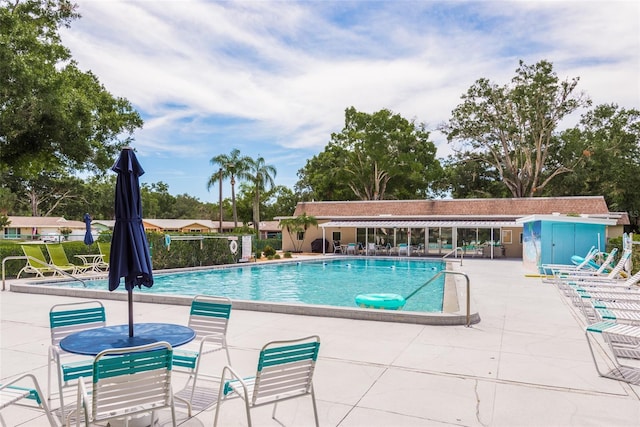 view of swimming pool with a patio area