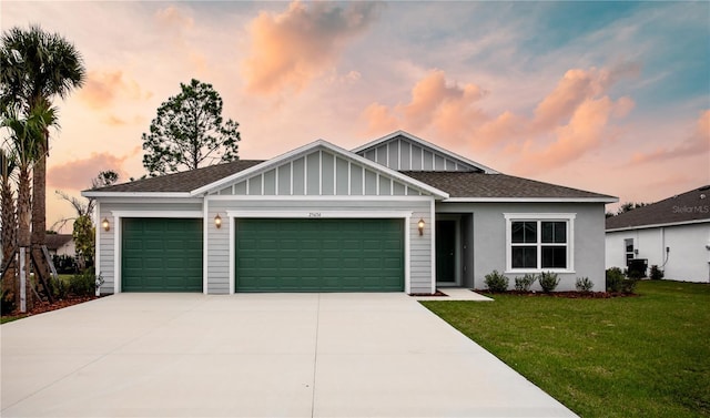 25434 Colon Dr, Punta Gorda, FL 33983 - view of front of home with an attached garage, a front yard, concrete driveway, roof with shingles, and board and batten siding