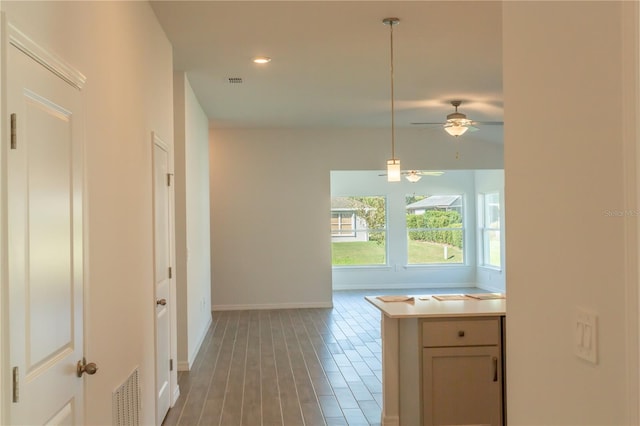 kitchen featuring pendant lighting, dark hardwood / wood-style flooring, and ceiling fan