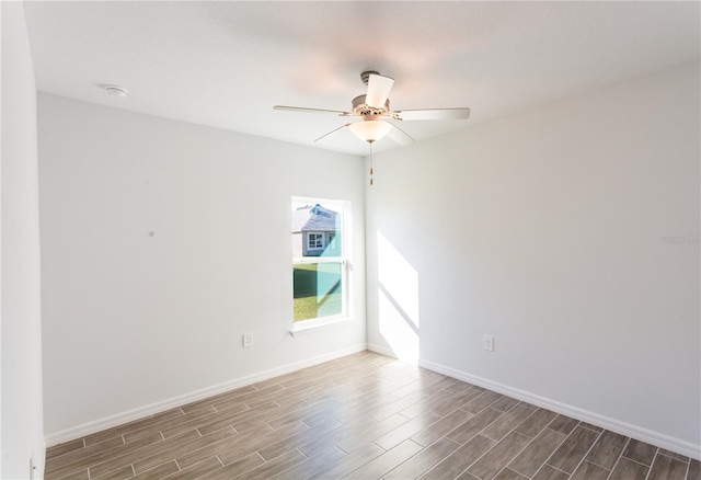 unfurnished room featuring hardwood / wood-style floors and ceiling fan