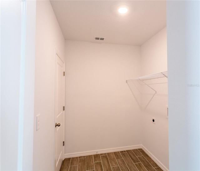 25434 Colon Dr, Punta Gorda, FL 33983 - laundry room with hookup for an electric dryer, baseboards, and wood tiled floors