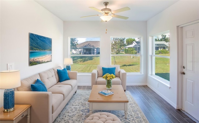 sunroom featuring ceiling fan